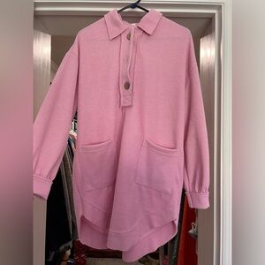 Light pink cozy shirt dress with three brown buttons